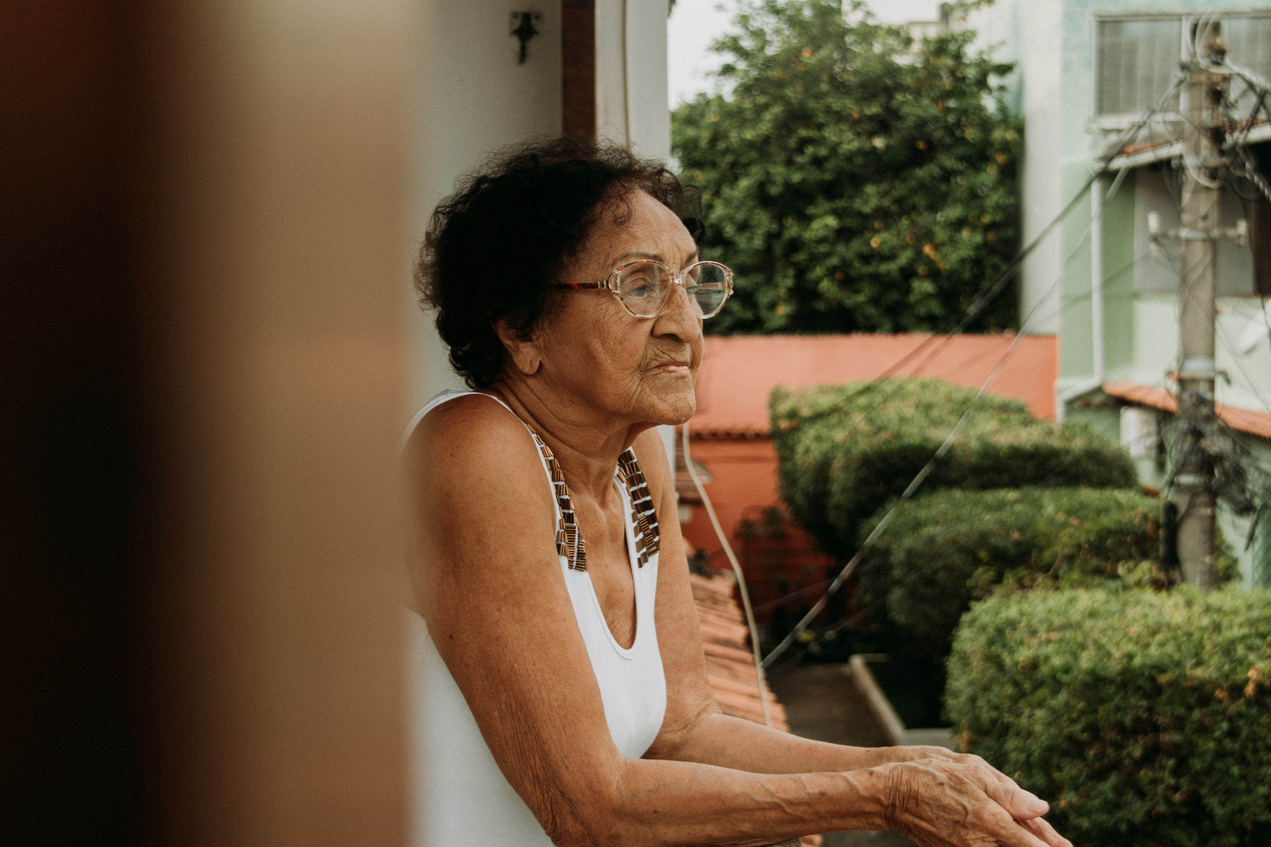 Thoughtful,Elderly,Brazilian,Woman,On,Her,Home's,Balcony,During,Quarantine